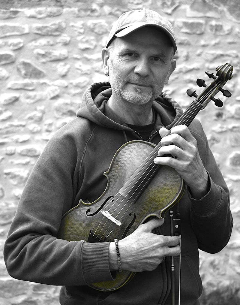 Vincent in Black and White holding his Fiddle across his chest